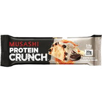 Musashi Protein Crunch white chocolate cookie and cream protein bar in its black and silver wrapper, featuring an illustration of a cookie and cream sandwich with chocolate chips.