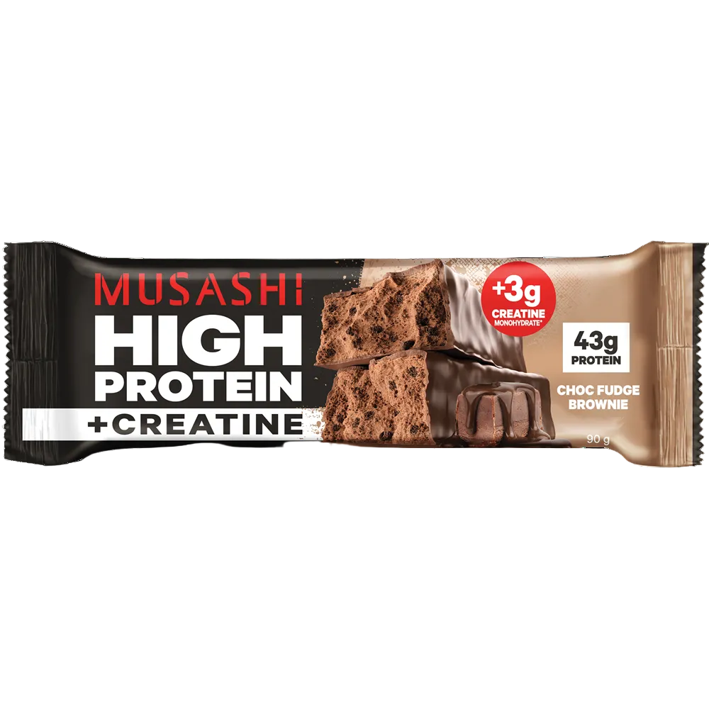 Musashi High Protein + Creatine chocolate brownie protein bar in its packaging, featuring a black and brown design with a chocolate brownie and drizzled chocolate on the front.
