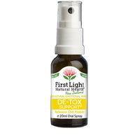 Bottle of First Light Natural Health De-Tox Support spray on a black background