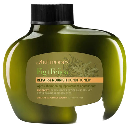 Green bottle of Antipodes Fig + Feijoa Repair & Nourish Conditioner on a black background