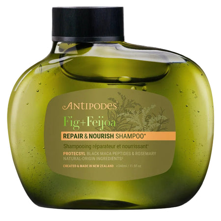 Green shampoo bottle with label on a black background