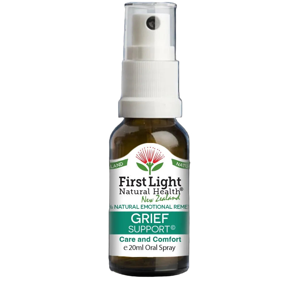 Bottle of First Light Natural Health Grief Support spray on a black background