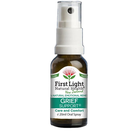 Bottle of First Light Natural Health Grief Support spray on a black background