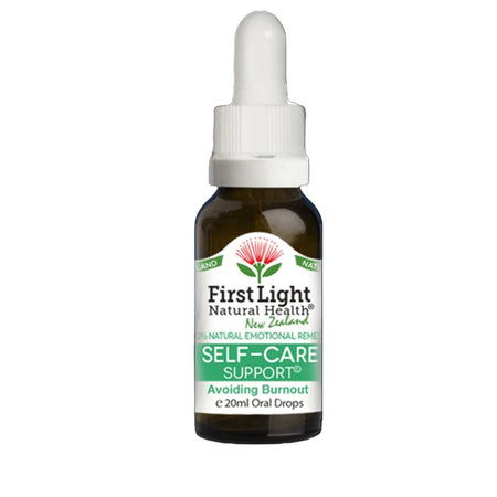 Bottle of First Light Natural Health Self-Care Support on a black background