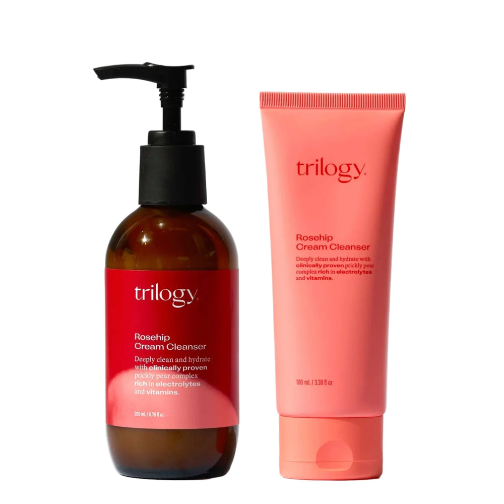 Two Trilogy skincare products on a gray background