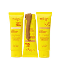 Three yellow tubes of Trilogy SPF 50+ sunscreen on a white background