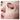 Close-up of a person wearing a pink face mask, focusing on the eye area.