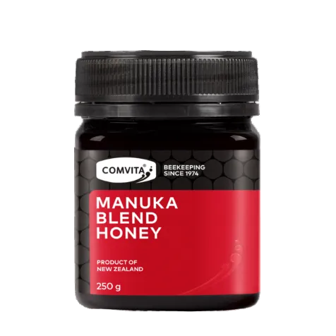 Jar of Comvita Manuka Blend Honey on a white background